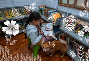 Janna, 11 años, y su amigo Simba en la Biblioteca Comunitaria Sueños de Papel, en Manrique, La Cruz. Foto: Esneyder Gutiérrez.