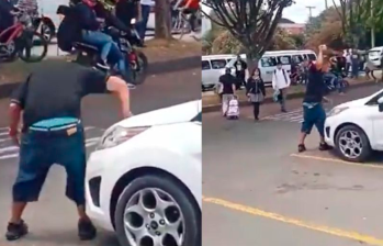 En video: Hombre golpeó a su esposa y le destruyó el carro en frente del colegio de sus hijas